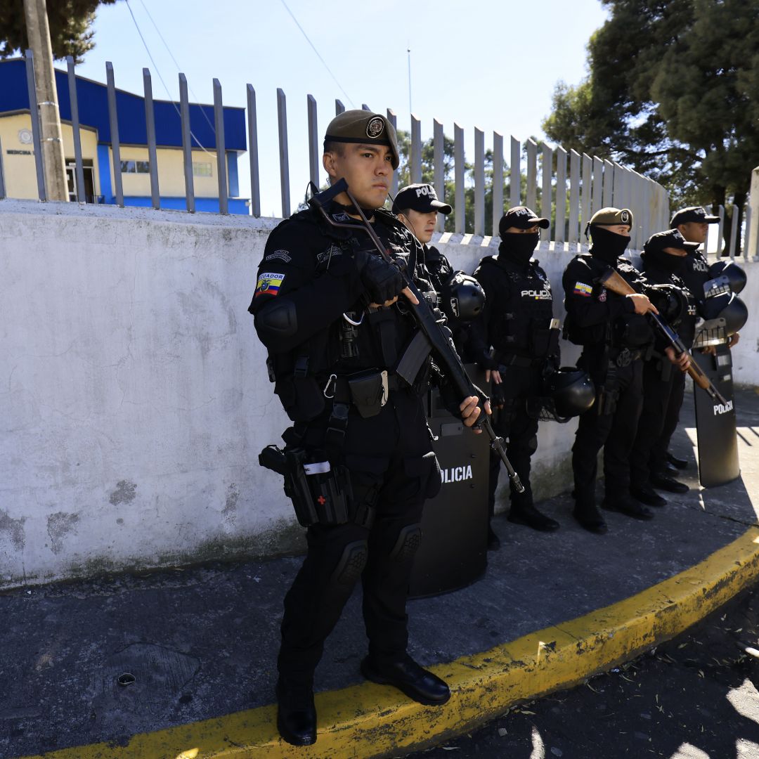 Police officers stand guard at the National Service of Legal Medicine and Forensic Science on Aug. 10, 2023, in Quito, Ecuador, following the assassination of a candidate running in the country's upcoming presidential election.