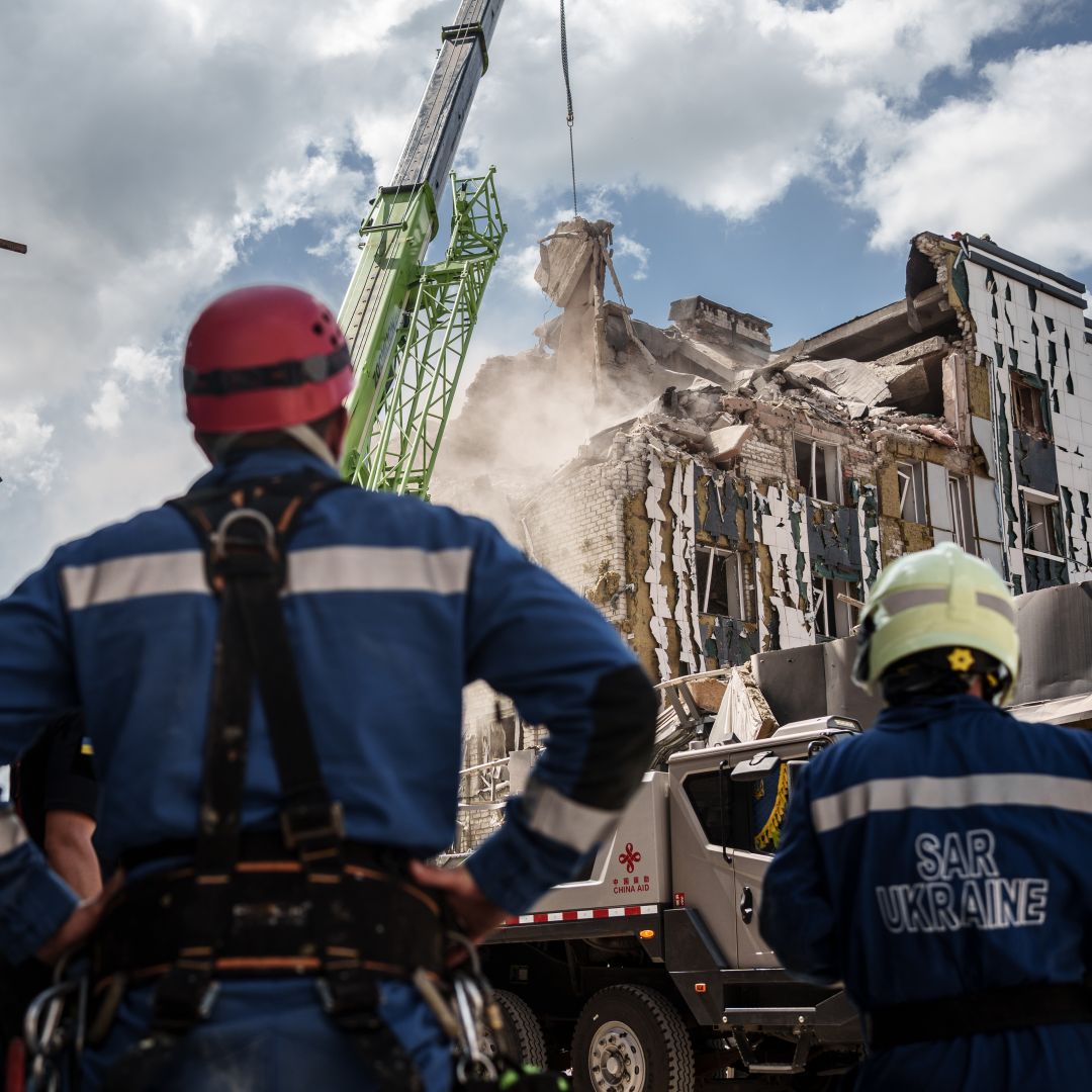 Rescuers use a crane to dismantle the rubble of a building destroyed by a Russian shelling on Aug. 8, 2023, in Pokrovsk, Ukraine. Rescuers use a crane to dismantle the rubble of a building destroyed by a Russian shelling on Aug. 8, 2023, in Pokrovsk, Ukraine.
