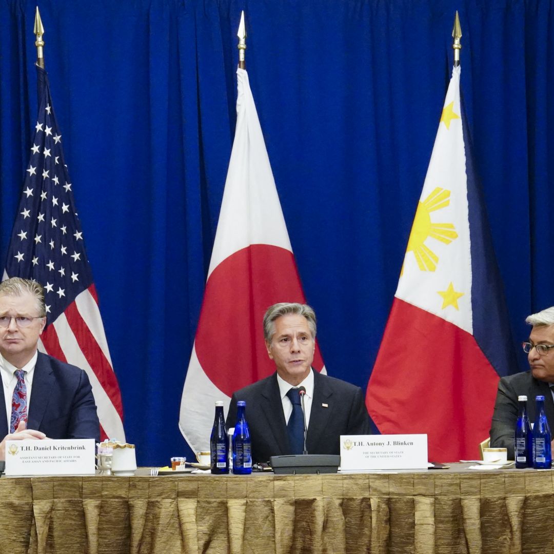 U.S. Secretary of State Antony Blinken (center), flanked by two other U.S. officials, is seen during a meeting with Japanese Foreign Minister Yoko Kamikawa and Philippine Foreign Minister Enrique Manalo (not pictured) on the sidelines of the 78th United Nations General Assembly at the Lotte Palace Hotel in New York City on Sept. 22, 2023.