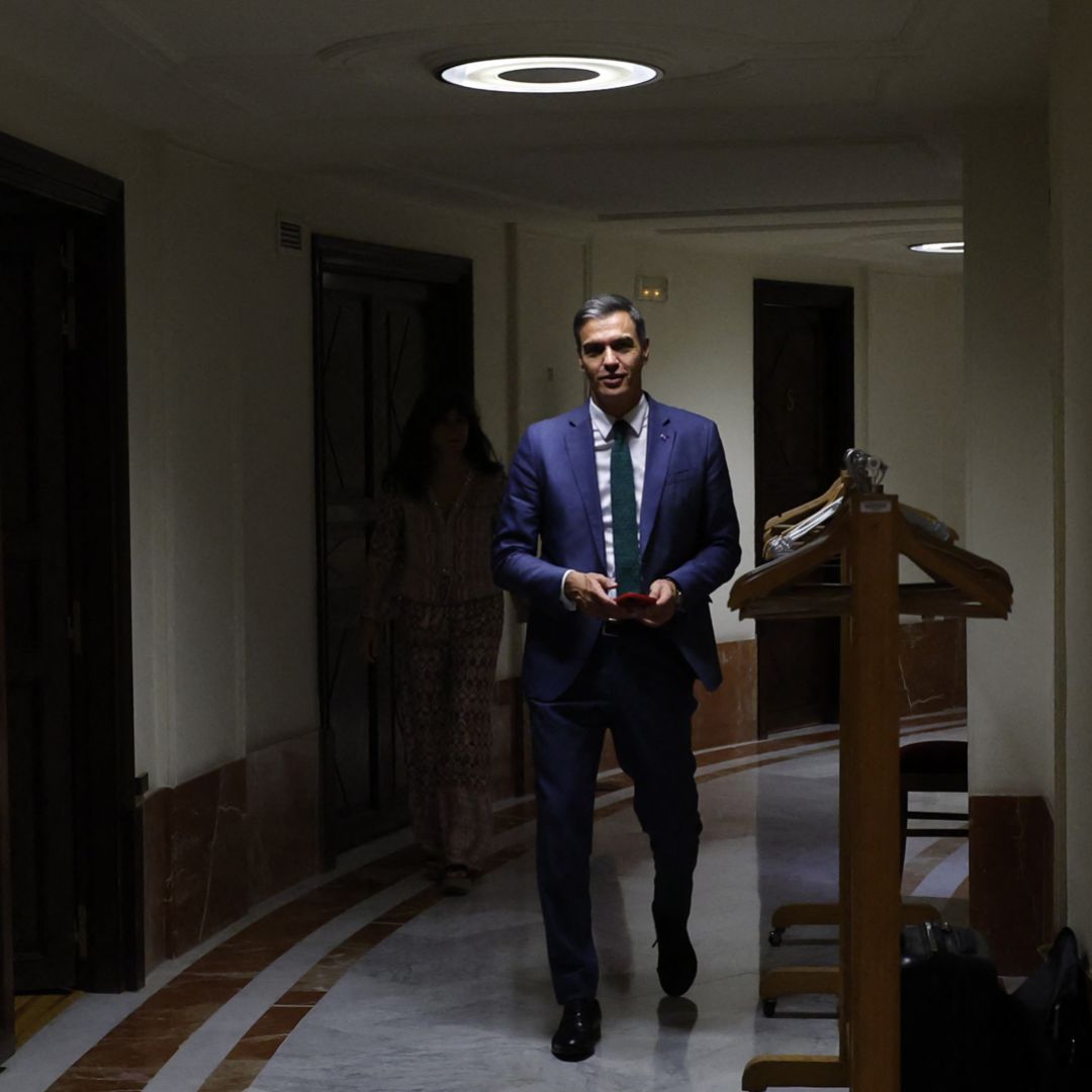 Acting Spanish Prime Minister Pedro Sanchez comes back to the chamber as he attends the first session of a parliamentary debate to vote through a prime minister in Madrid on Sept. 26, 2023. 