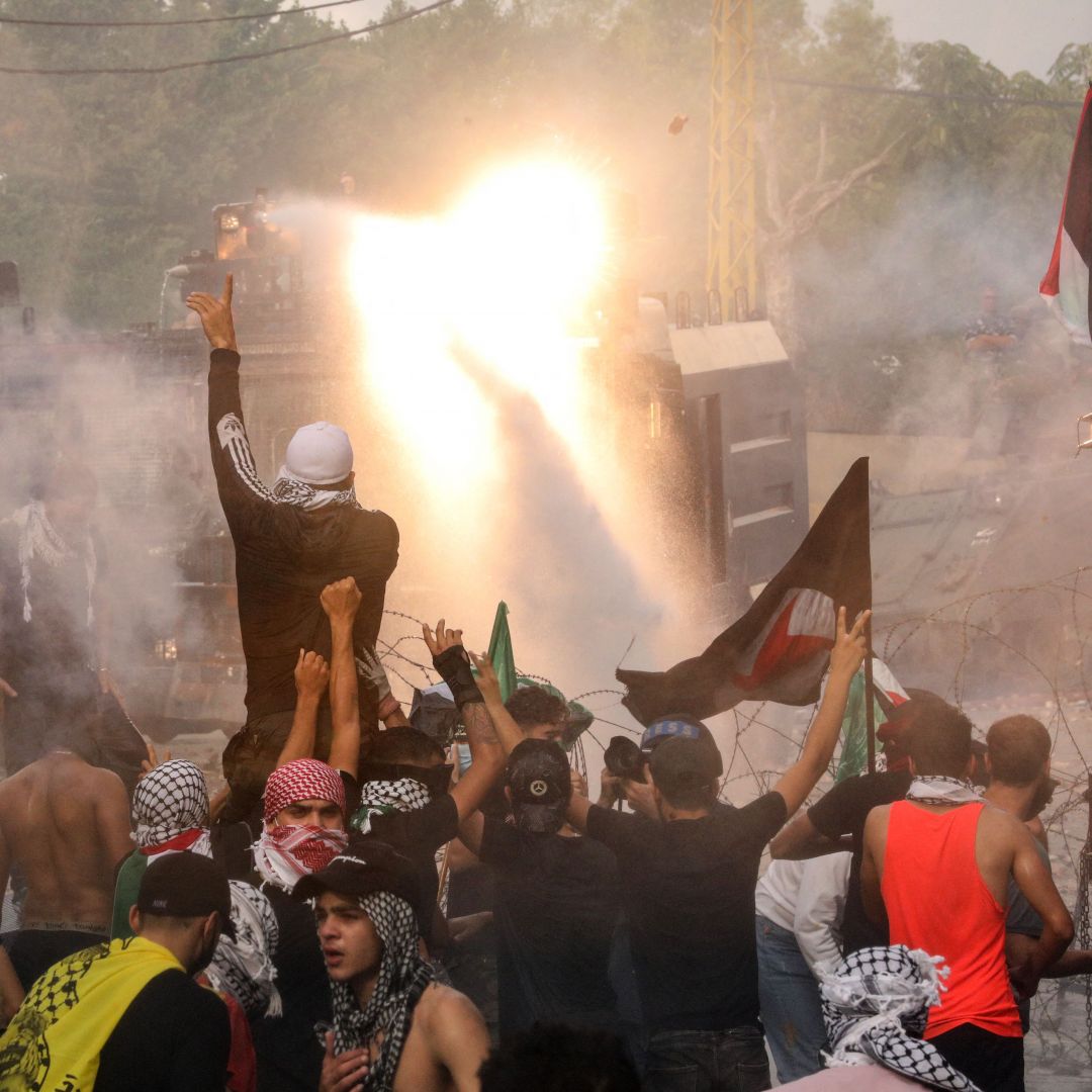 Lebanese security forces use water cannons as they clash with protesters outside the U.S. embassy near Beirut on Oct. 18, 2023, during a demonstration in solidarity with Palestinians amid the latest Hamas-Israel war.