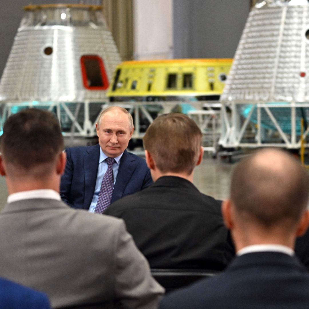 Russian President Vladimir Putin talks with scientists during a visit to the Rocket and Space Corporation (RSC) Energia in Korolyov, outside Moscow, on Oct. 26, 2023. 
