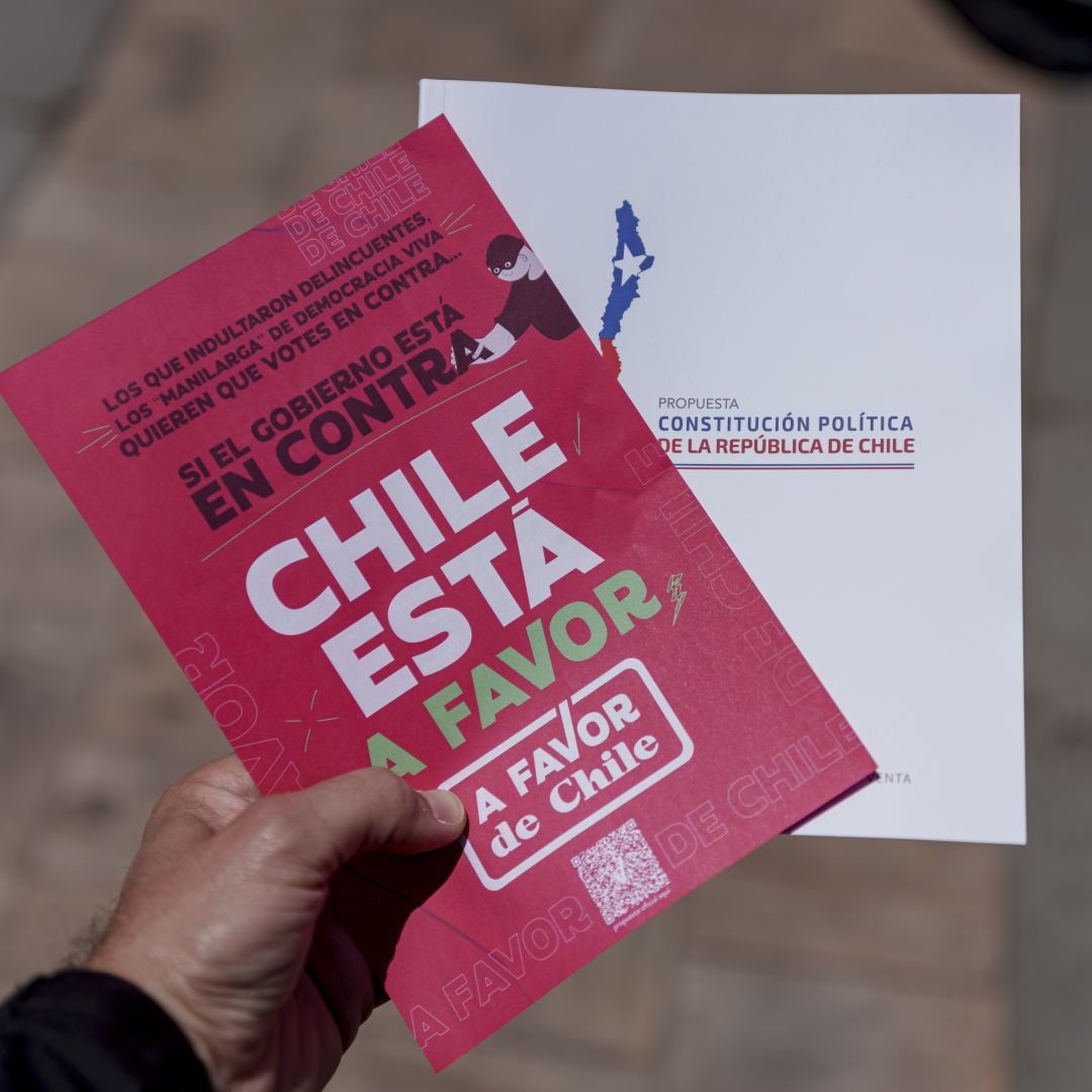 A man holds a handout in support of Chile’s proposed new constitution on Dec. 6, 2023, in Santiago.