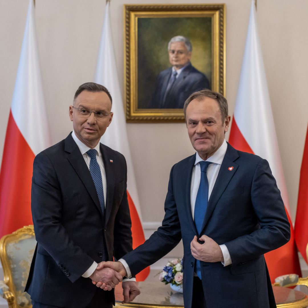 Polish President Andrzej Duda (left) and Polish Prime Minister Donald Tusk (right) shake hands during their meeting at the Presidential Palace in Warsaw, Poland, on Jan. 15, 2024. 
