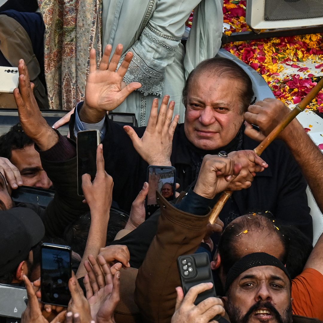 Pakistan's former prime minister and the leader of the Pakistan Muslim League-Nawaz party, Nawaz Sharif (center), waves to supporters during a campaign rally in Lahore, Pakistan, on Jan. 23, 2024. 