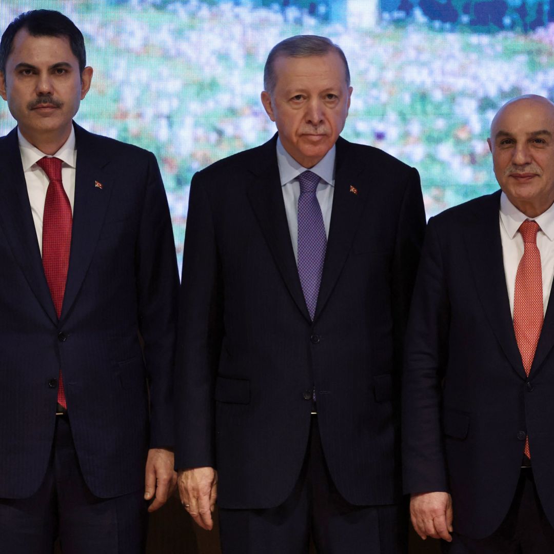 Turkish President Recep Tayyip Erdogan (center) poses with Istanbul mayoral candidate Murat Kurum (left) and Ankara mayoral candidate Turgut Altinok (right) during the presentation of the Justice and Development Party's election manifesto in Ankara, Turkey, on Jan. 30, 2024.