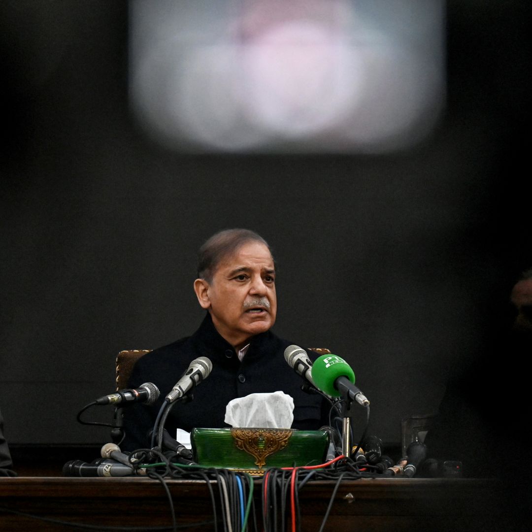 Former Pakistani Prime Minister and leader of the Pakistan Muslim League-Nawaz (PML-N) party, Shehbaz Sharif (center) speaks during a press conference in Lahore on Feb. 13, 2024. 