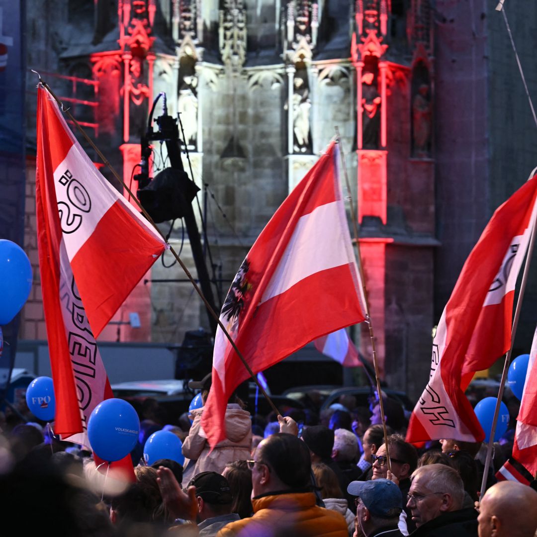 Supporters of the far-right Freedom Party of Austria (FPO) wave flags during an election rally in Vienna, Austria, on Sept. 27, 2024. 