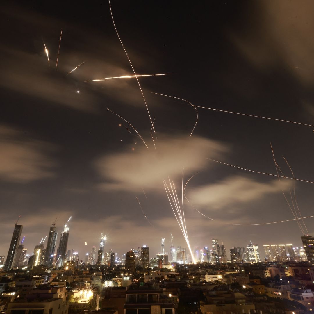 Israeli air defense systems are activated to intercept Iranian missiles over the Israeli city of Tel Aviv early on June 18, 2025. 