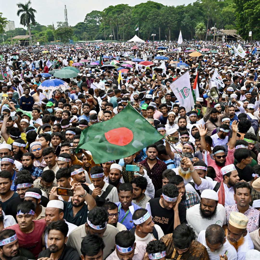 Supporters of Bangladesh's Jamaat-e-Islami party wave the national flag in Dhaka during a rally held to call for the introduction of a proportional representation system in the country's forthcoming general election on July 19, 2025. Supporters of Bangladesh's Jamaat-e-Islami party wave the national flag in Dhaka during a rally held to call for the introduction of a proportional representation system in the country's forthcoming general election on July 19, 2025.