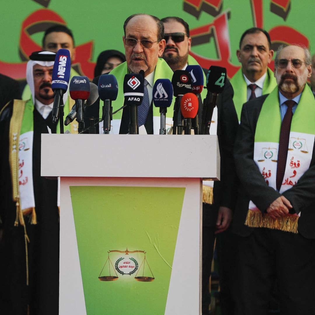 Former Iraqi Prime Minister Nouri al-Maliki (center) delivers a speech during a campaign rally in Baghdad ahead of parliamentary elections on Nov. 7, 2025. Former Iraqi Prime Minister Nouri al-Maliki (center) delivers a speech during a campaign rally in Baghdad ahead of parliamentary elections on Nov. 7, 2025.
