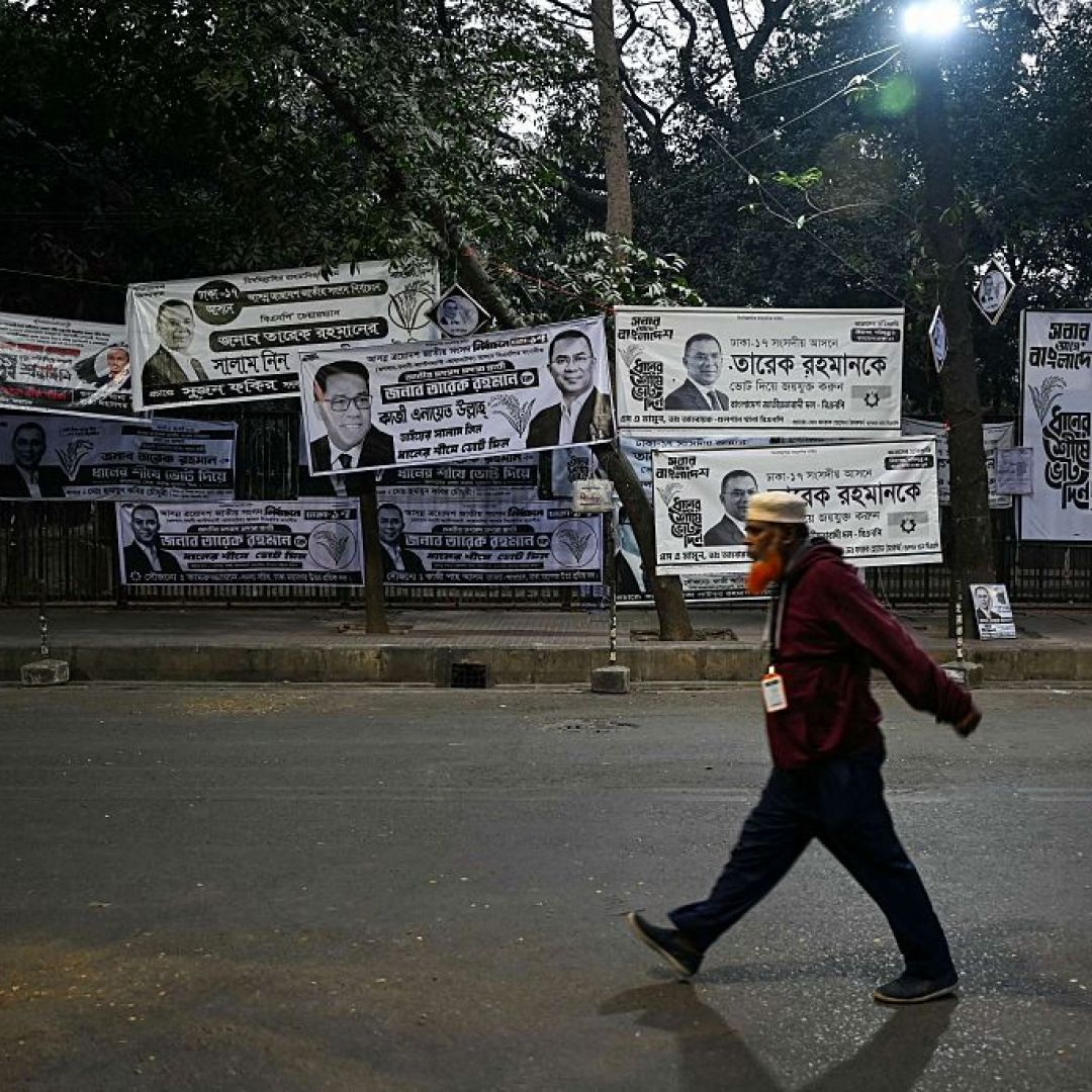 A man walks past campaign posters of Bangladesh Nationalist Party (BNP) chairman and Tarique Rahman in Dhaka on Feb. 13, 2026. A man walks past campaign posters of Bangladesh Nationalist Party (BNP) chairman and Tarique Rahman in Dhaka on Feb. 13, 2026.
