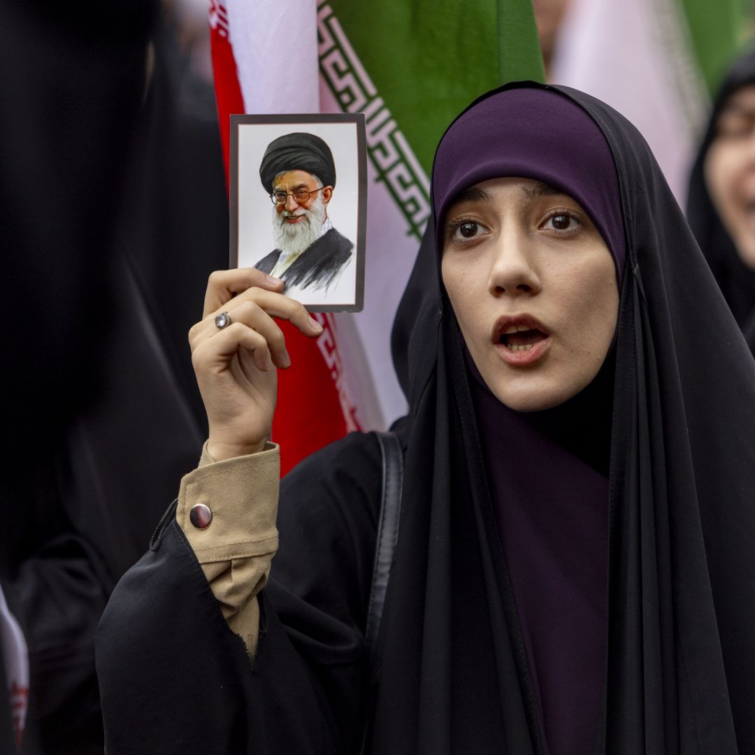 A woman holds a photo of Ayatollah Ali Khamenei as Iranians protest against attacks on Iran by Israel and the United States on Feb. 28, 2026 in Tehran, Iran. A woman holds a photo of Ayatollah Ali Khamenei as Iranians protest against attacks on Iran by Israel and the United States on Feb. 28, 2026 in Tehran, Iran.