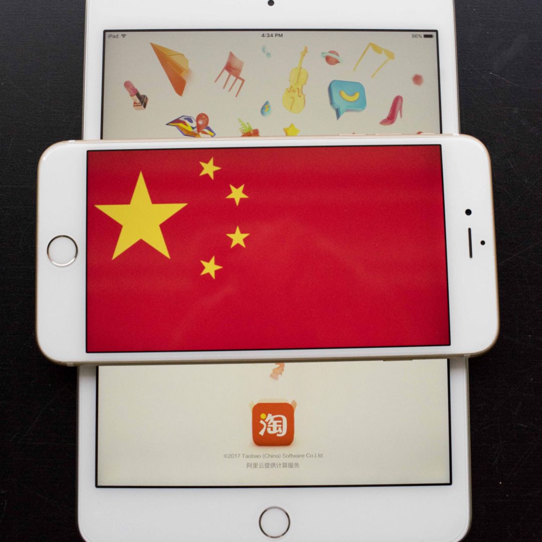 The Chinese flag is seen on a display of an iPhone in Hong Kong. The Chinese flag is seen on a display of an iPhone in Hong Kong.