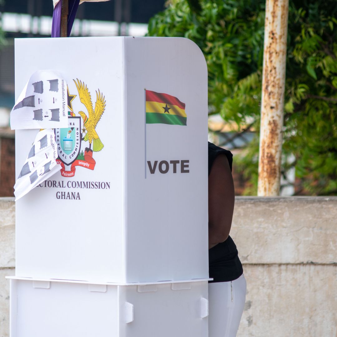 A voter casts their ballot in a voting booth in Ghana in June 2020.