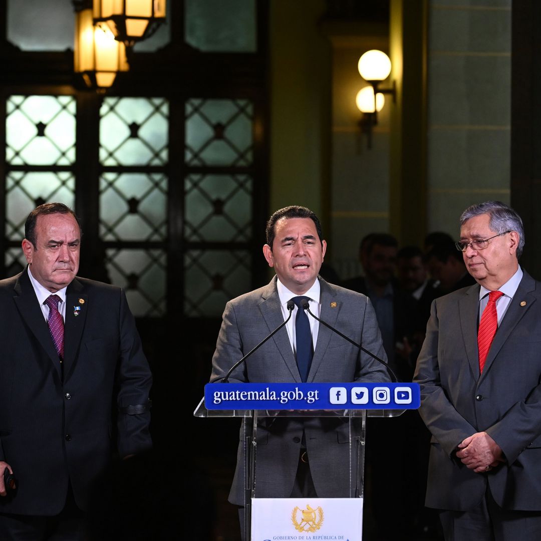 This photo shows Guatemalan President Jimmy Morales speaking to reporters during a news conference in Guatemala City on Aug. 14, 2019.