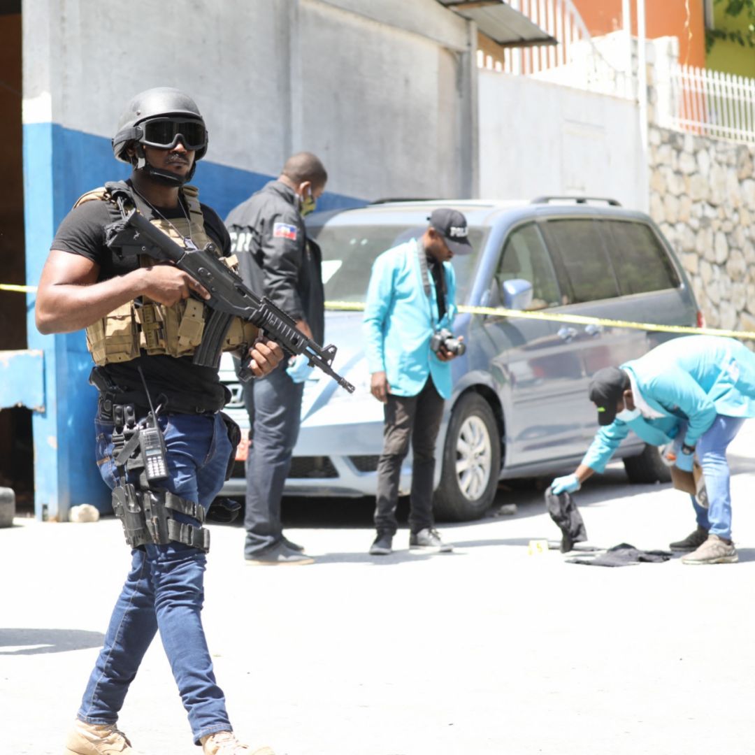 Haitian security forces look for evidence outside of President Jovenel Moise’s residence in Port-au-Prince following his assassination on July 7, 2021. 