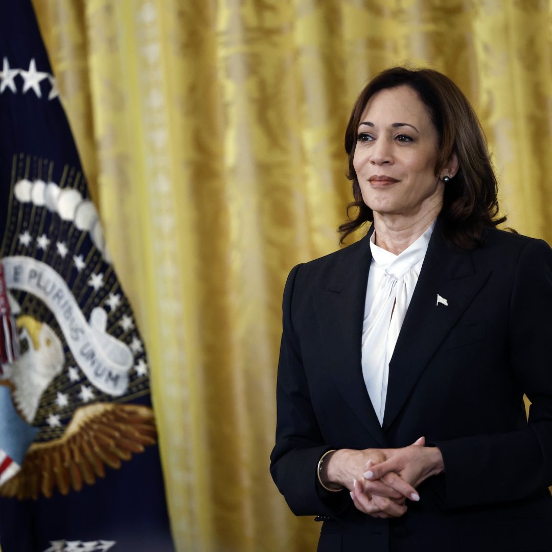 U.S. Vice President Kamala Harris listens as President Joe Biden speaks during a Women's History Month reception in the White House on March 18, 2024.