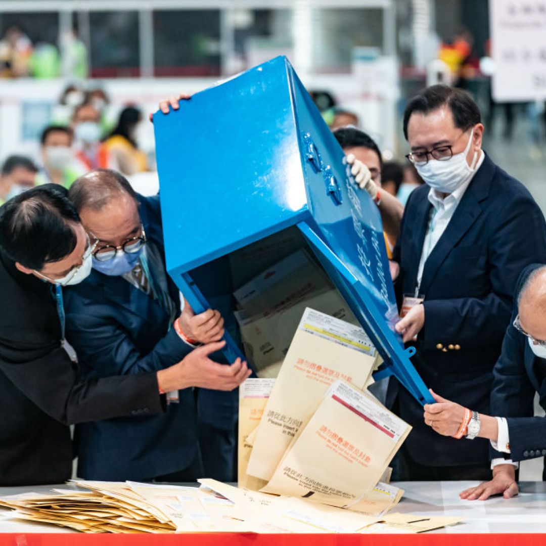 Officials open a ballot box as vote counting starts Sept. 19, 2021, in Hong Kong. Officials open a ballot box as vote counting starts Sept. 19, 2021, in Hong Kong.
