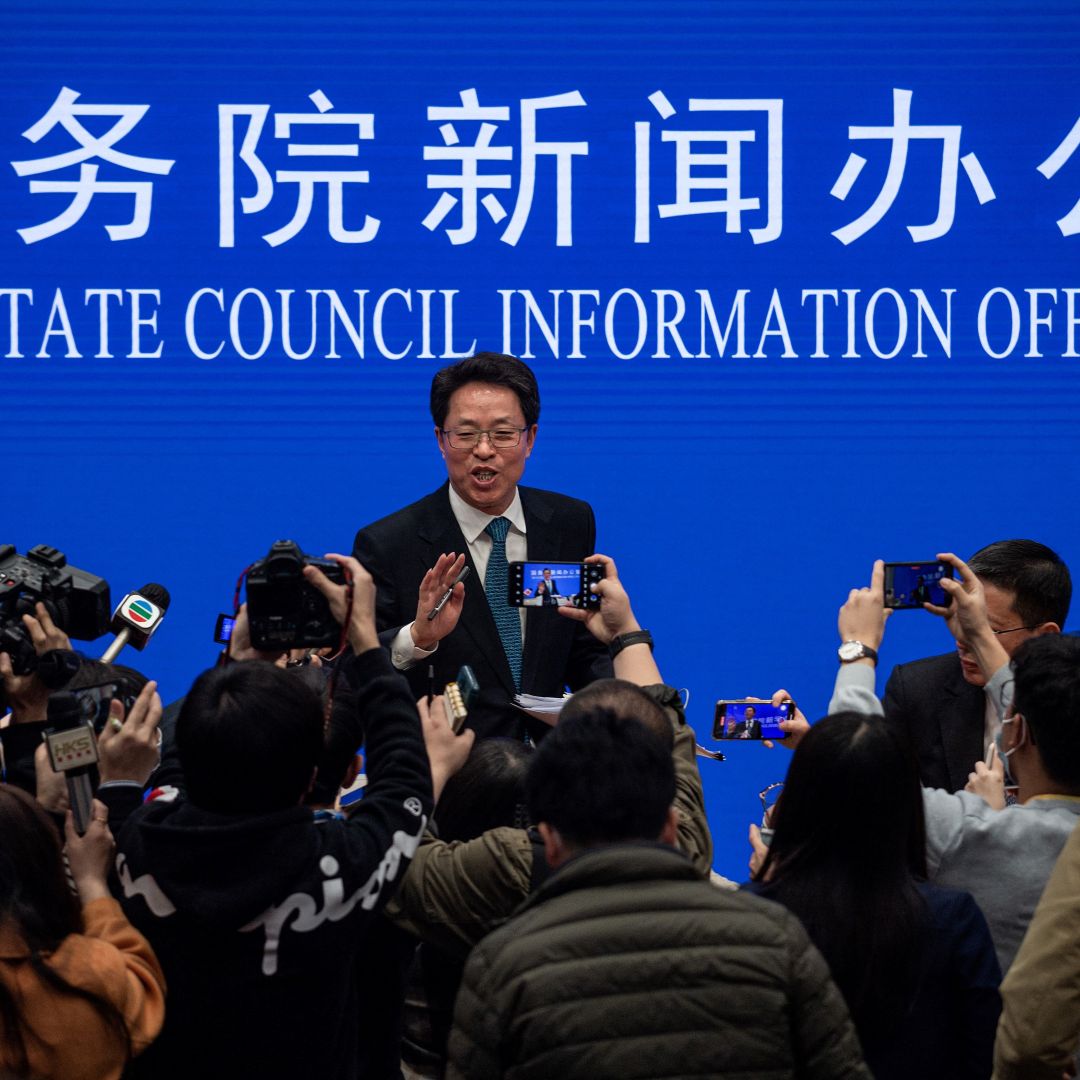 Zhang Xiaoming (C), Executive Deputy Director of the Hong Kong and Macao Affairs Office of the State Council, at the end of a State Council press conference on Hong Kong electoral reform March 12, 2021, in Beijing.