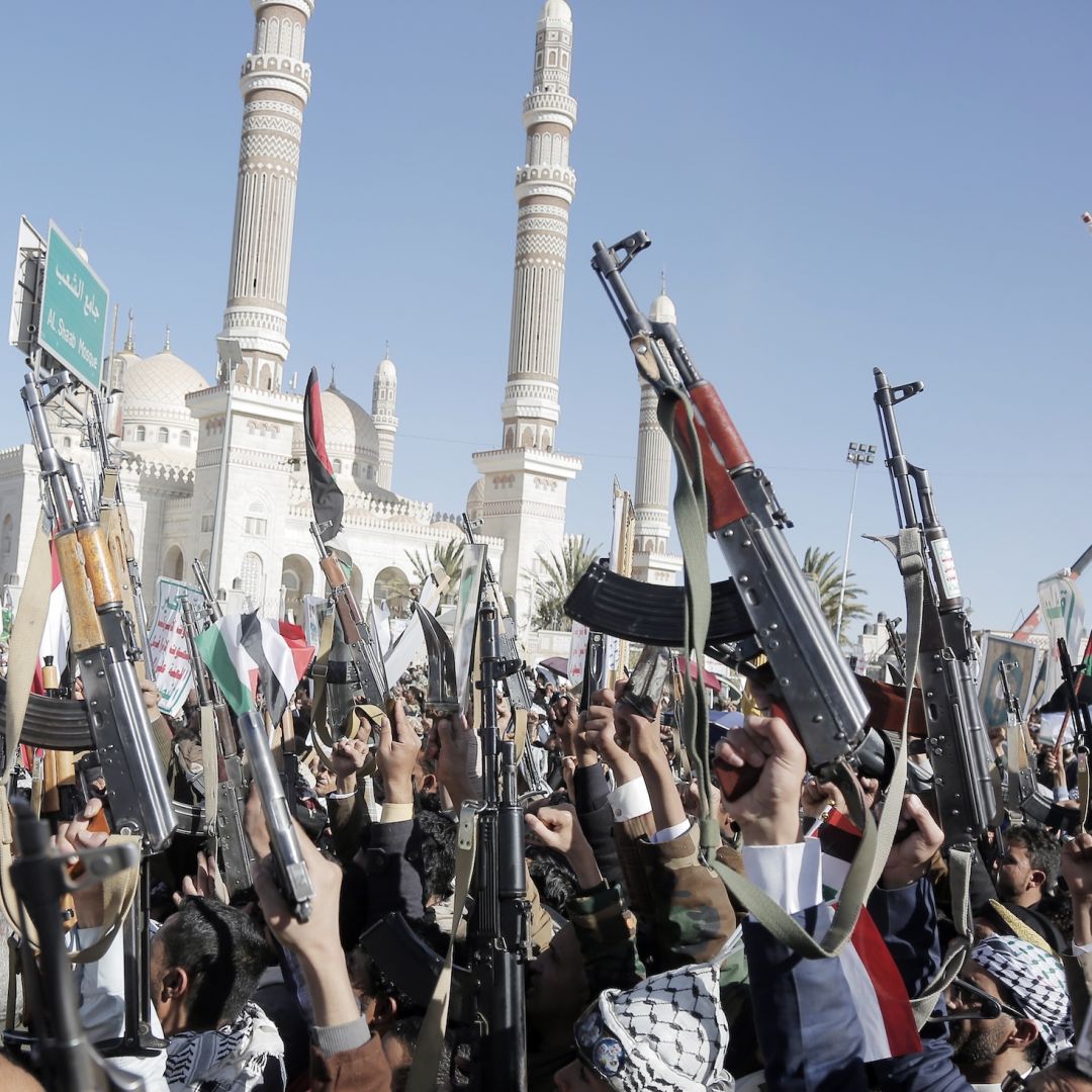 Supporters of Yemen's Houthi movement brandish weapons and chant slogans as they take part in a protest staged in solidarity with the Palestinian people in Gaza on Jan. 17, 2025, in Sanaa, Yemen. 