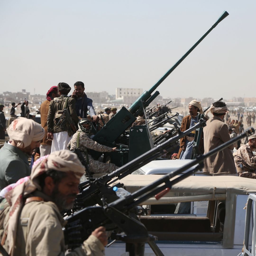 Yemen's Houthi fighters man machine guns mounted on trucks as they participate in a weaponized protest staged against the United States and Israel on Nov. 6, 2025 in Sanaa, Yemen. 