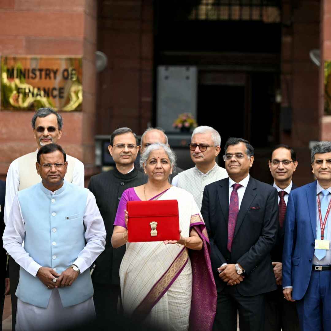 Indian Finance Minister Nirmala Sitharaman (fifth from left) poses for photos in New Delhi before presenting India's budget to parliament on July 23, 2024. 