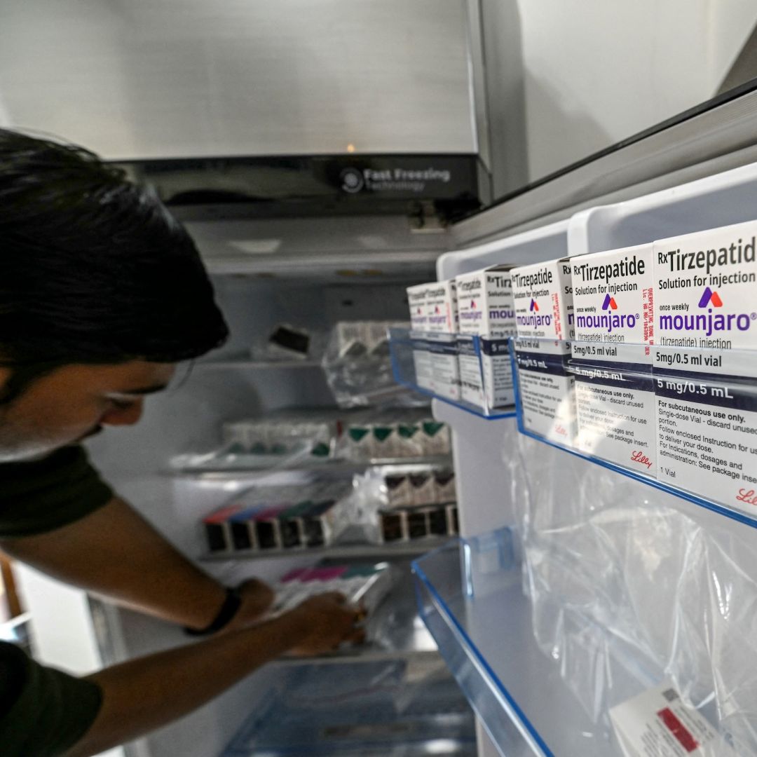 A medicine distributor stores Mounjaro (tirzepatide) self-injecting GLP-1 prefilled pens and vials in a fridge at his office in Thane, India, on March 20, 2026. A medicine distributor stores Mounjaro (tirzepatide) self-injecting GLP-1 prefilled pens and vials in a fridge at his office in Thane, India, on March 20, 2026.