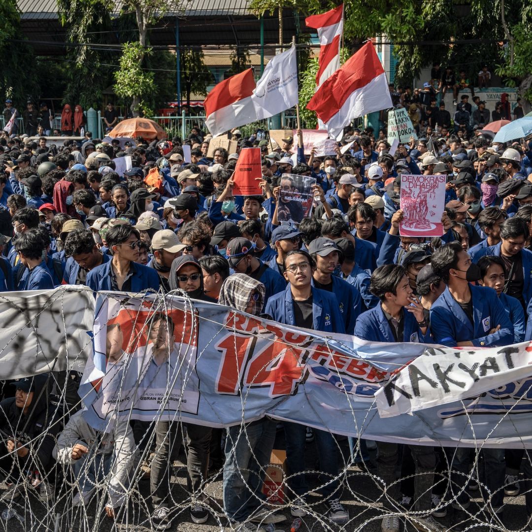 People gather in front of the East Java Provincial Parliament in Surabaya, Indonesia, on Aug. 23, 2024, as they protest against a move to overturn a Constitutional Court decision on election rules. 