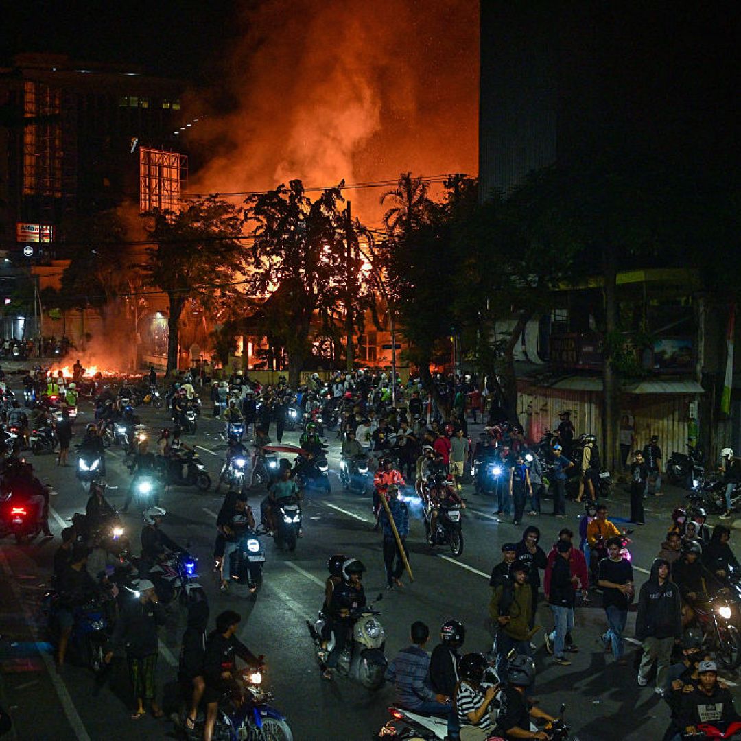 A protest in front of police headquarters Aug. 31 in in Surabaya, Indonesia. Mass protests are poised to continue absent unlikely and large government concessions, but President Prabowo Subianto's position will remain secure. A protest in front of police headquarters Aug. 31 in in Surabaya, Indonesia.