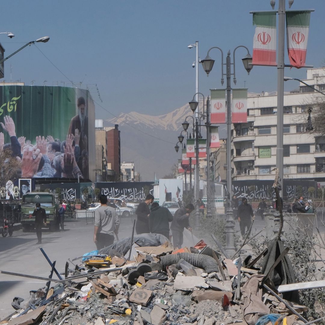 Volunteers clean up the rubble outside a government building in Tehran, Iran, that was destroyed by U.S. and Israeli strikes on March 4, 2026. Volunteers clean up the rubble outside a government building in Tehran, Iran, that was destroyed by U.S. and Israeli strikes on March 4, 2026.
