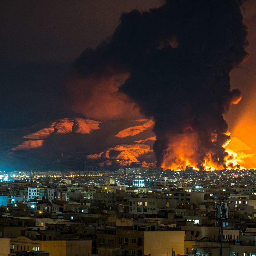 Smoke and flames rise at the site of airstrikes on an oil depot in Tehran, Iran, on March 7, 2026.