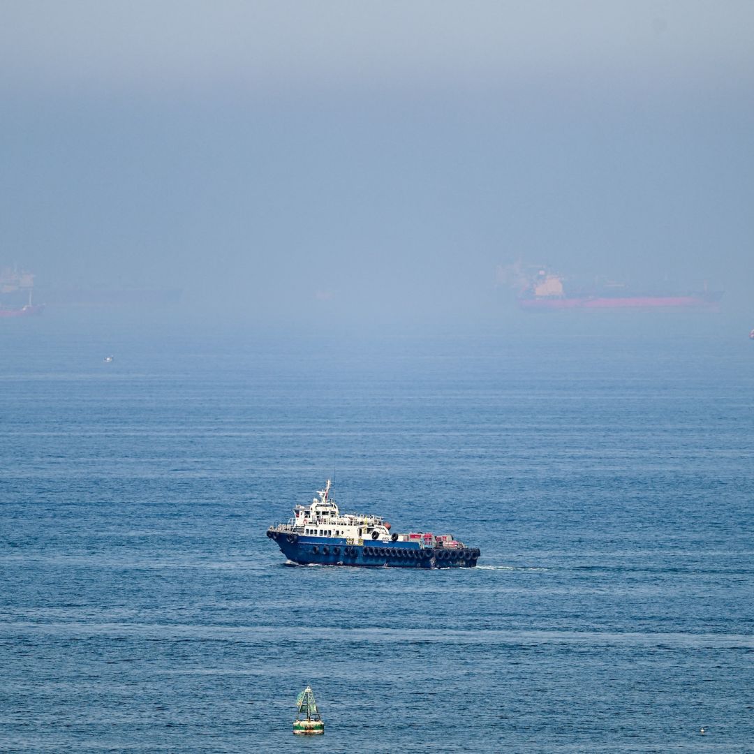 Cargo ships June 19 off the coast of the Khor Fakkan Container Terminal in Sharjah emirate, along the Gulf of Oman. On the heels of growing domestic political pushback in the United States, Washington and Tehran will enter a second week of the 60-day ceasefire.