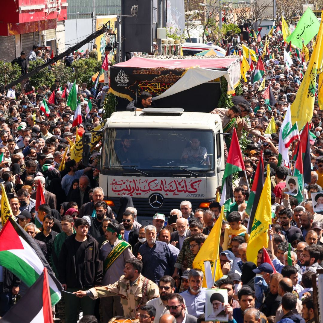 People attend an April 5, 2024, funeral procession for seven Islamic Revolutionary Guard Corps members killed in an Israeli strike in Syria.