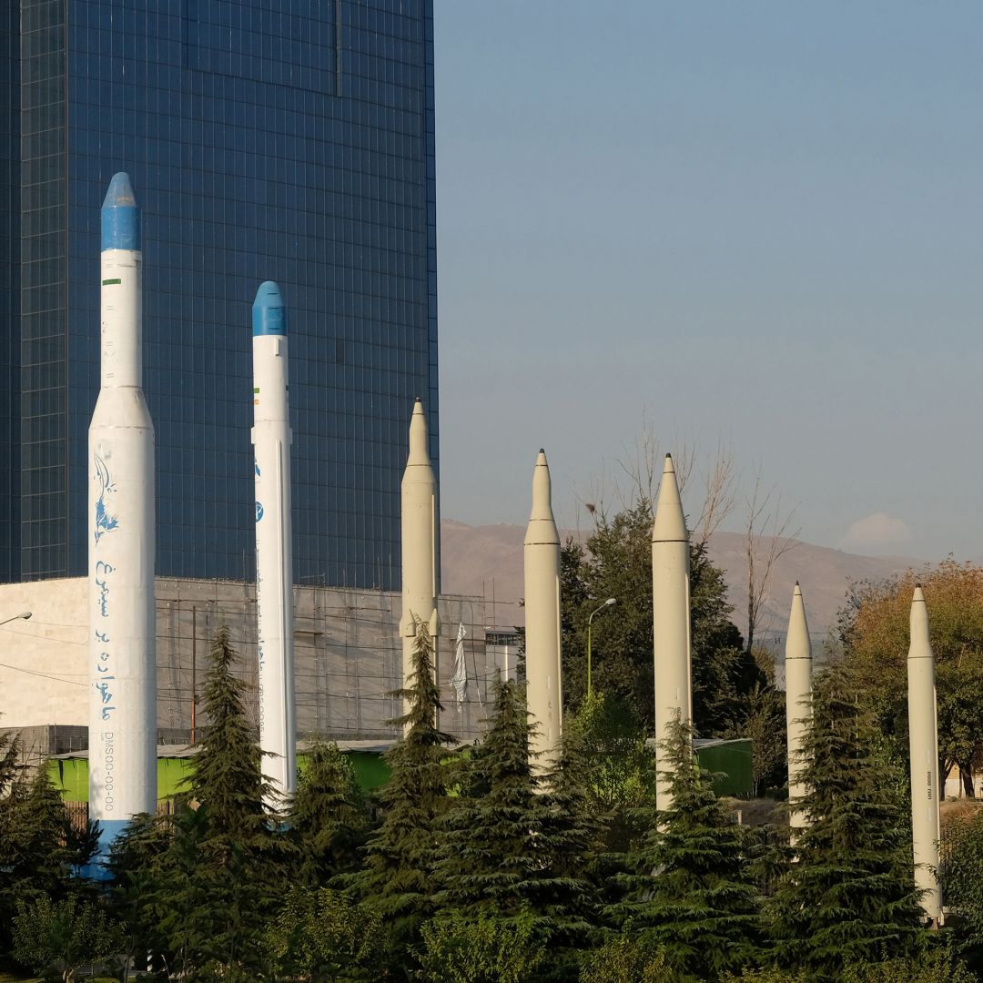 Iranian-made satellite carriers (left) and missiles (right) are displayed in front of the Holy Defense Museum in Tehran, Iran, on Sept. 20, 2020.