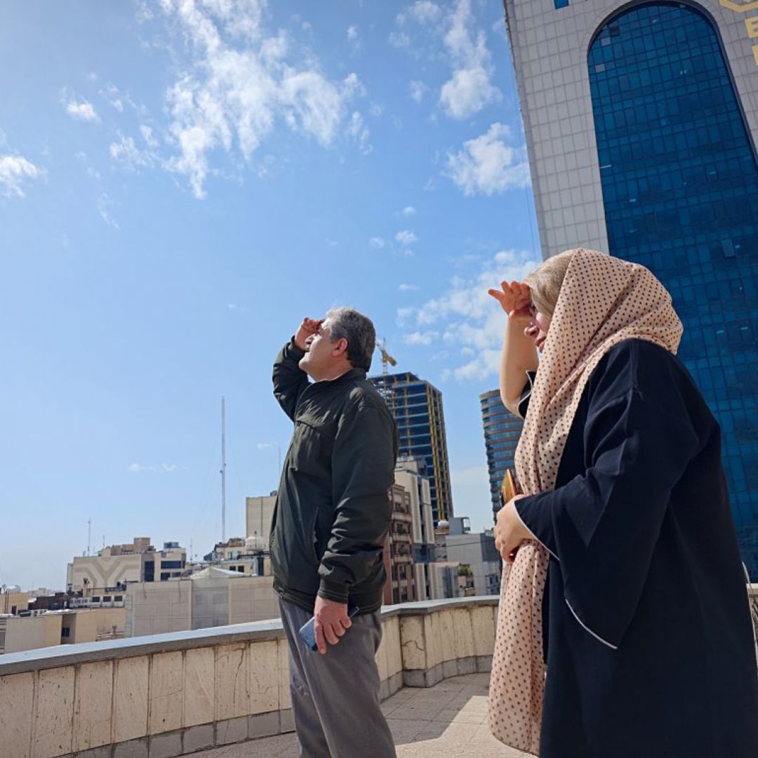 People in Tehran look to the skies from a rooftop amid reports of widespread U.S. and Israeli attacks in Iran on Feb. 28, 2026. People in Tehran look to the skies from a rooftop amid reports of widespread U.S. and Israeli attacks in Iran on Feb. 28, 2026.