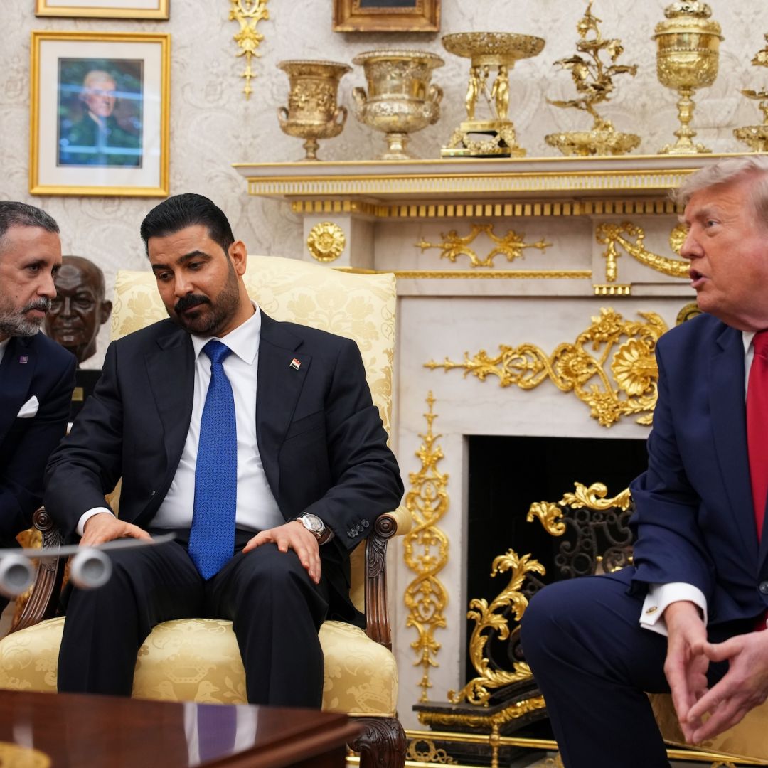 U.S. President Donald Trump (right) speaks during a meeting with Iraqi Prime Minister Ali al-Zaidi (2nd-L) in the Oval Office of the White House on July 14, 2026.