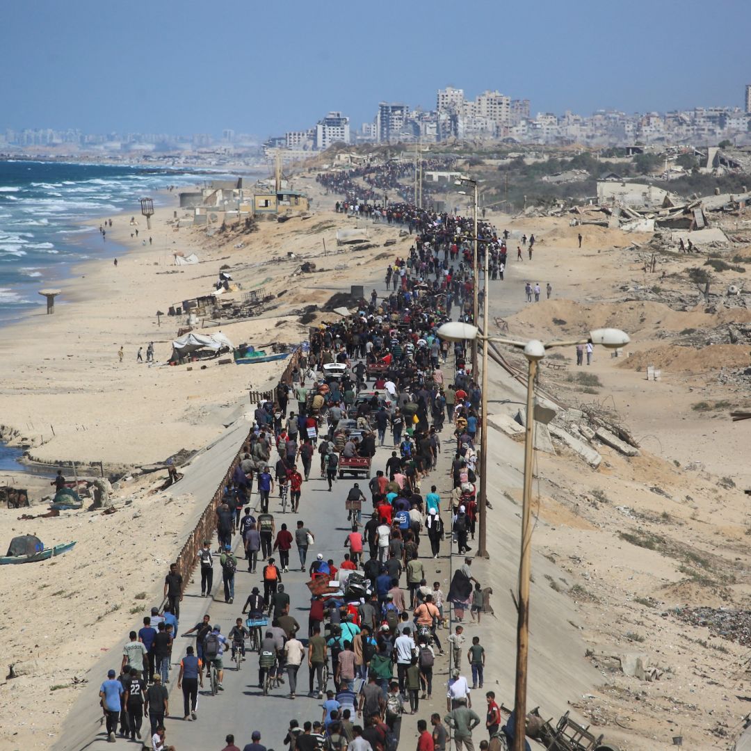 Palestinians on Oct. 10 on Al-Rashid road headed toward Gaza City.