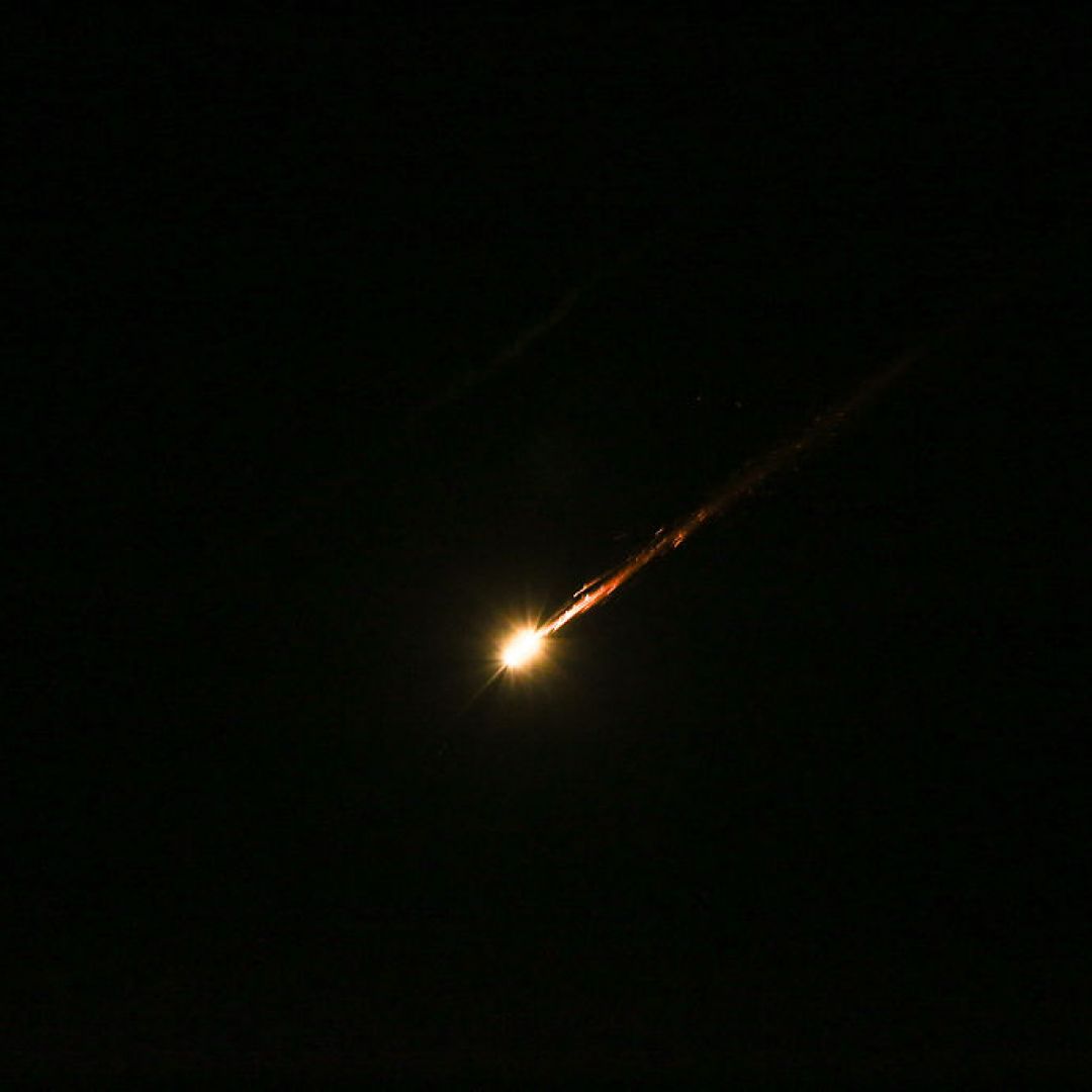 Iranian missiles aimed at targets in Israel pass through the sky over the West Bank on June 17, 2025. 