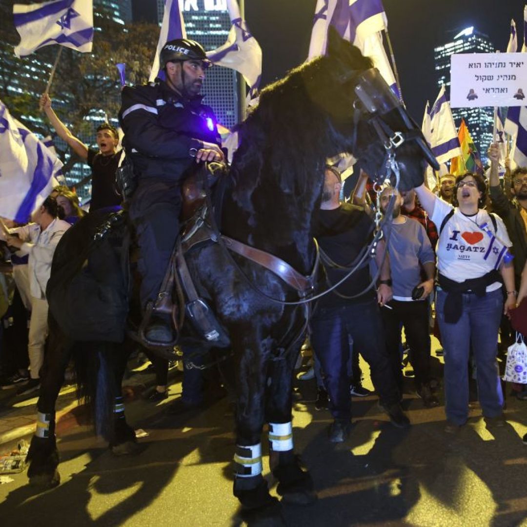 A mounted policeman stands guard during a March 27, 2023, protest in Tel Aviv, Israel. A mounted policeman stands guard during a March 27, 2023, protest in Tel Aviv, Israel.