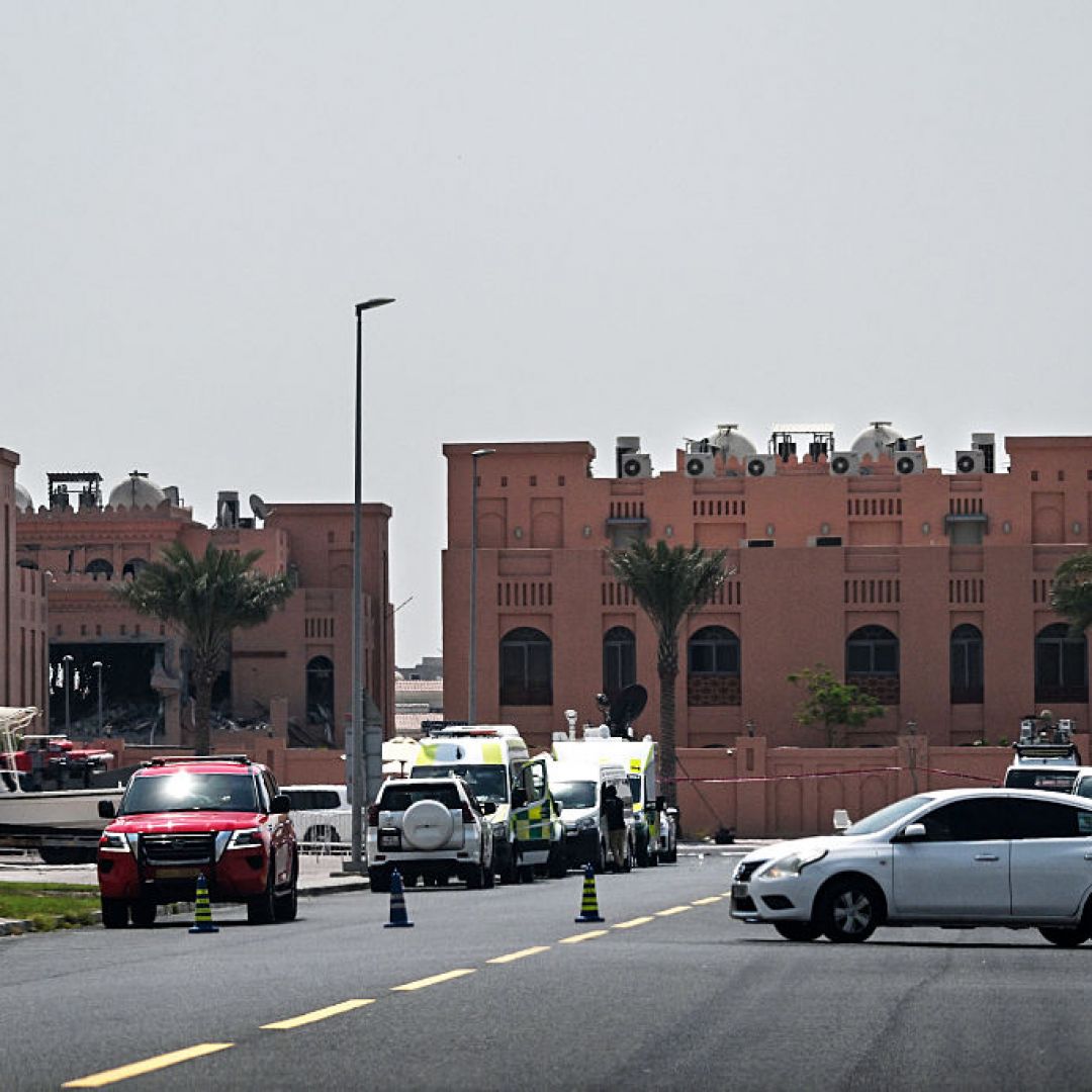 A picture taken from a distance shows the damaged building (L) in the Qatari compound housing members of Hamas' political bureau on Sept. 10, 2025. Israel targeted the building the previous day in a strike in Qatar's capital, Doha. 