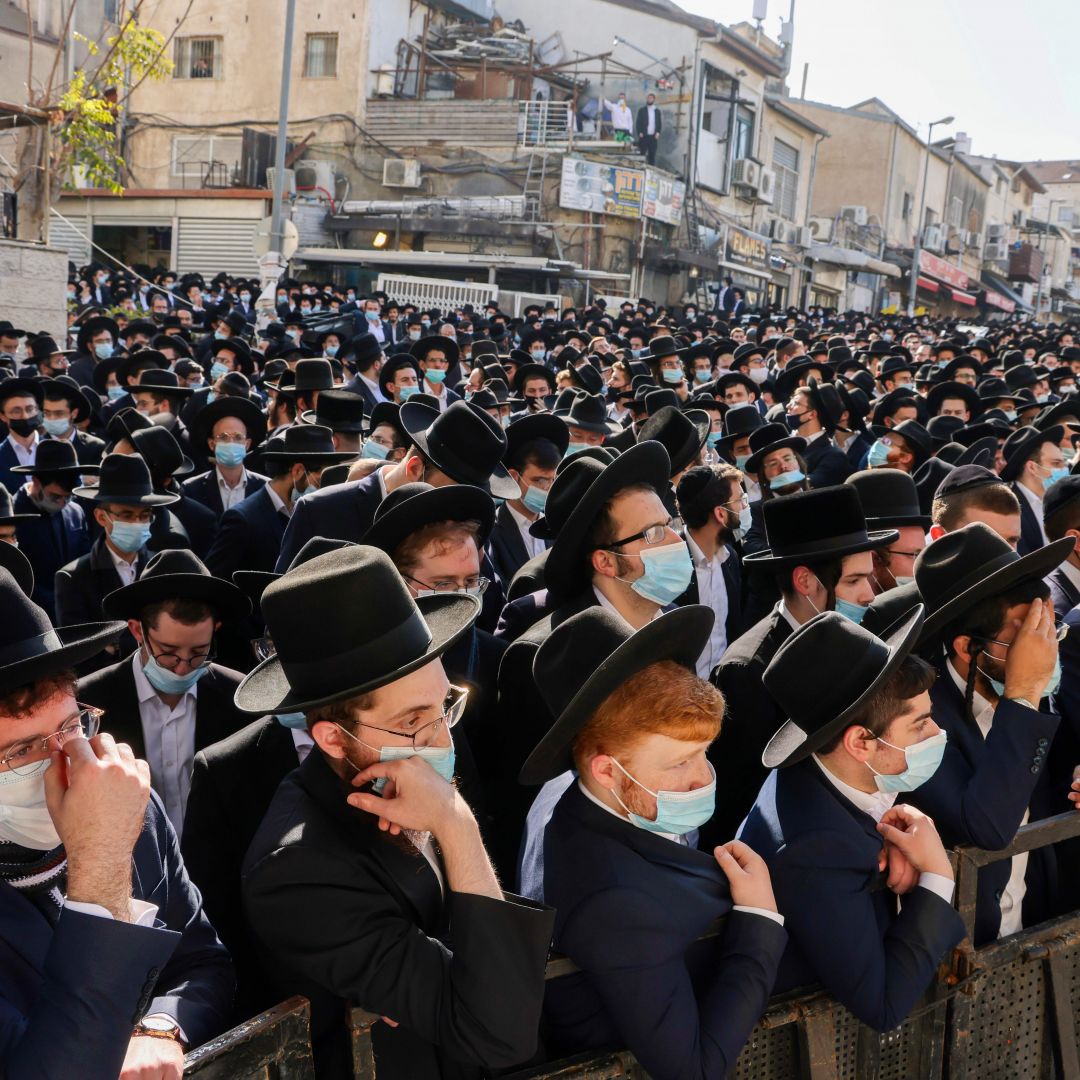 Ultra-Orthodox Jewish men attend the funeral of Rabbi Aharon David Hadash, the spiritual leader of the Mir Yeshiva, in Jerusalem's ultra-Orthodox neighborhood of Beit Yisrael on Dec. 3, 2020. Ultra-Orthodox Jewish men attend the funeral of Rabbi Aharon David Hadash, the spiritual leader of the Mir Yeshiva, in Jerusalem's ultra-Orthodox neighborhood of Beit Yisrael on Dec. 3, 2020.
