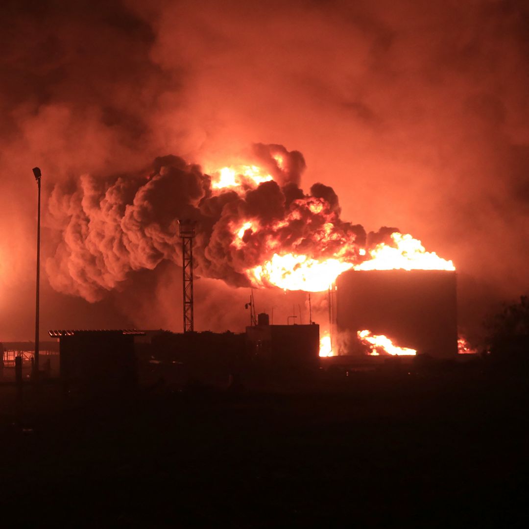 A giant fire erupts at an oil storage facility following Israeli strikes in Yemen's Houthi-held port city of Hodeida on July 20, 2024. 