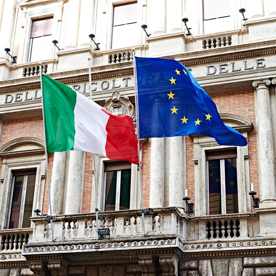 The Italian and EU flags are seen outside government buildings in Rome. The Italian and EU flags are seen outside government buildings in Rome.
