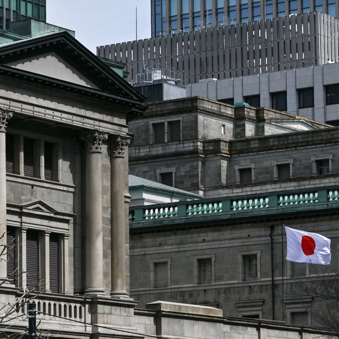 The Japanese flag flies outside the Bank of Japan (BoJ) headquarters in central Tokyo on March 19, 2024. 
