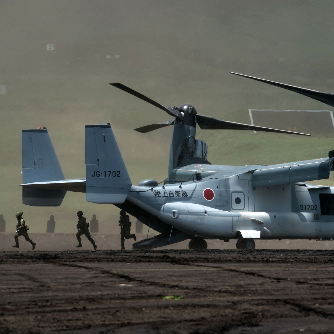 Members of the Japan Ground Self-Defense Force (JGSDF) disembark from an aircraft during a military exercise at the East Fuji Maneuver Area in Gotemba, Japan on May 28, 2022. 