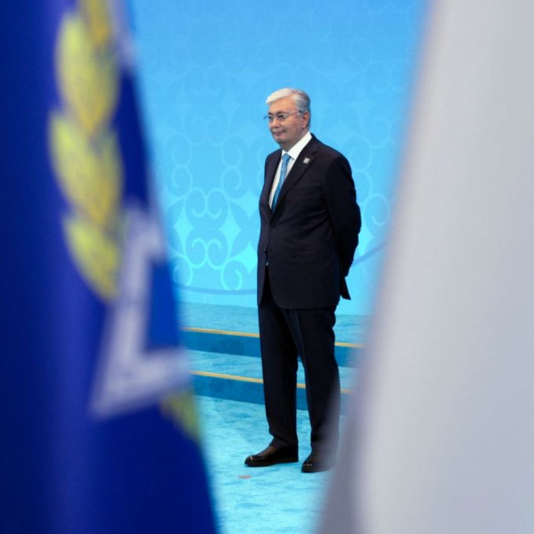 In this pool photograph distributed by the Russian state agency Sputnik, Kazakh President Kassym-Jomart Tokayev waits to greet foreign leaders during the Shanghai Cooperation Organization member states leaders' summit in Astana on July 4, 2024.