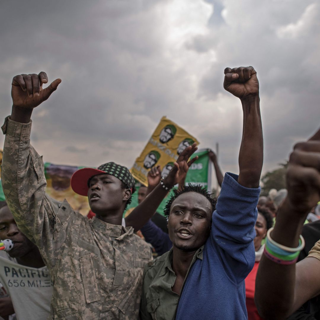 Supporters react to Kenyan Deputy President William Ruto’s speech during a presidential campaign rally in Kibera, the largest slum in Nairobi, on Jan. 18, 2022. 