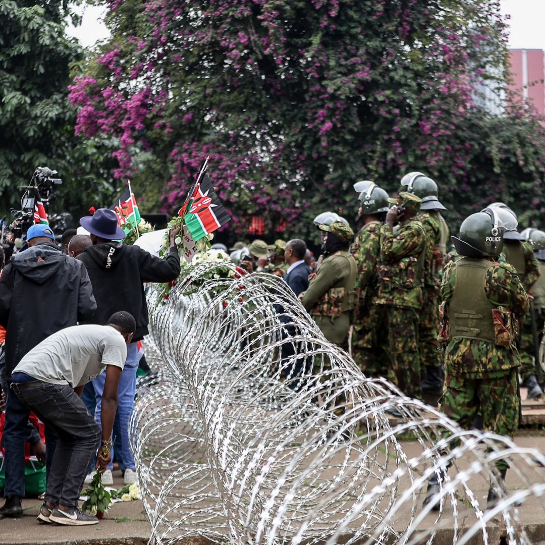 Protesters march outside Parliament to honor victims of the June 25, 2024, protest on June 25, 2026, in Nairobi, Kenya.