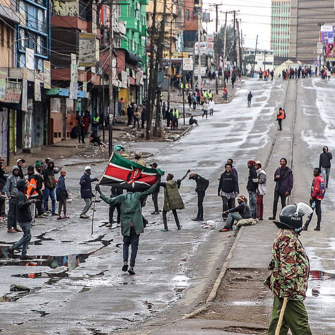 A demonstrator holds a Kenyan flag on a street in Nairobi, Kenya, during a pro-democracy protest on July 7, 2025. A demonstrator holds a Kenyan flag on a street in Nairobi, Kenya, during a pro-democracy protest on July 7, 2025.